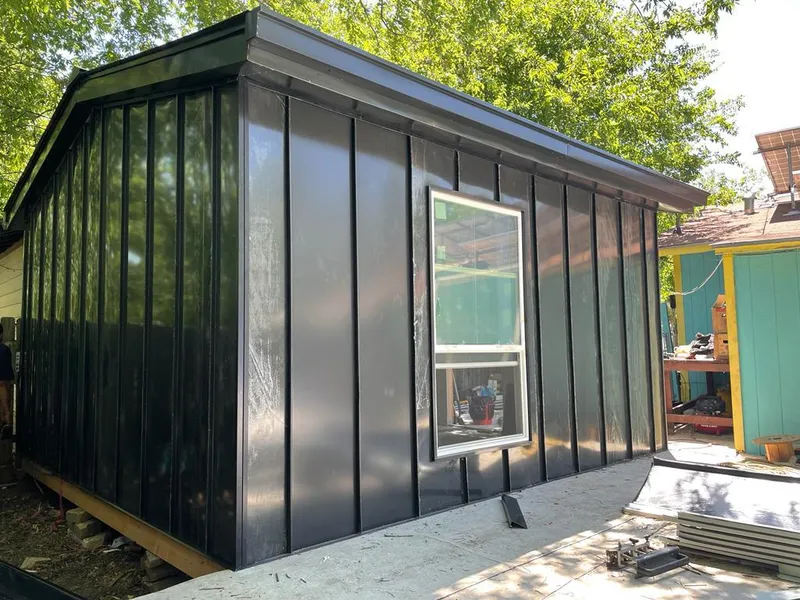 Black standing seam metal wall panels for Roof Inspection in Webster City